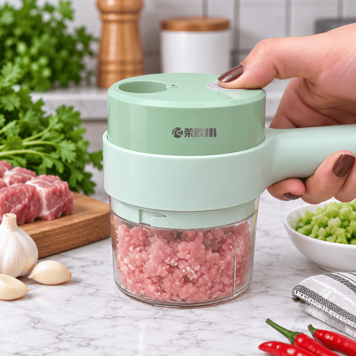Electric onion and garlic chopper with compact handheld design