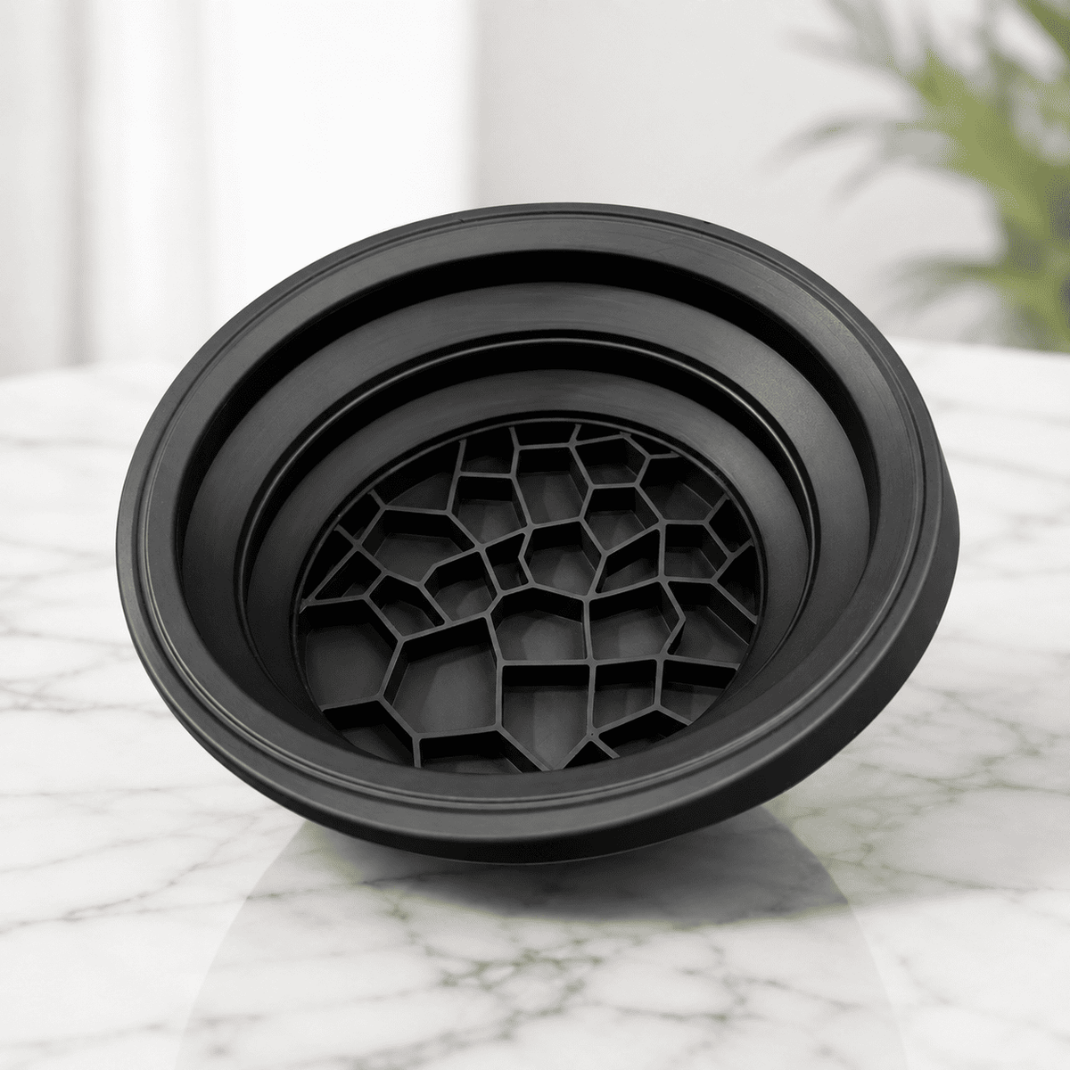 Pink silicone facial ice bowl for skincare routine
